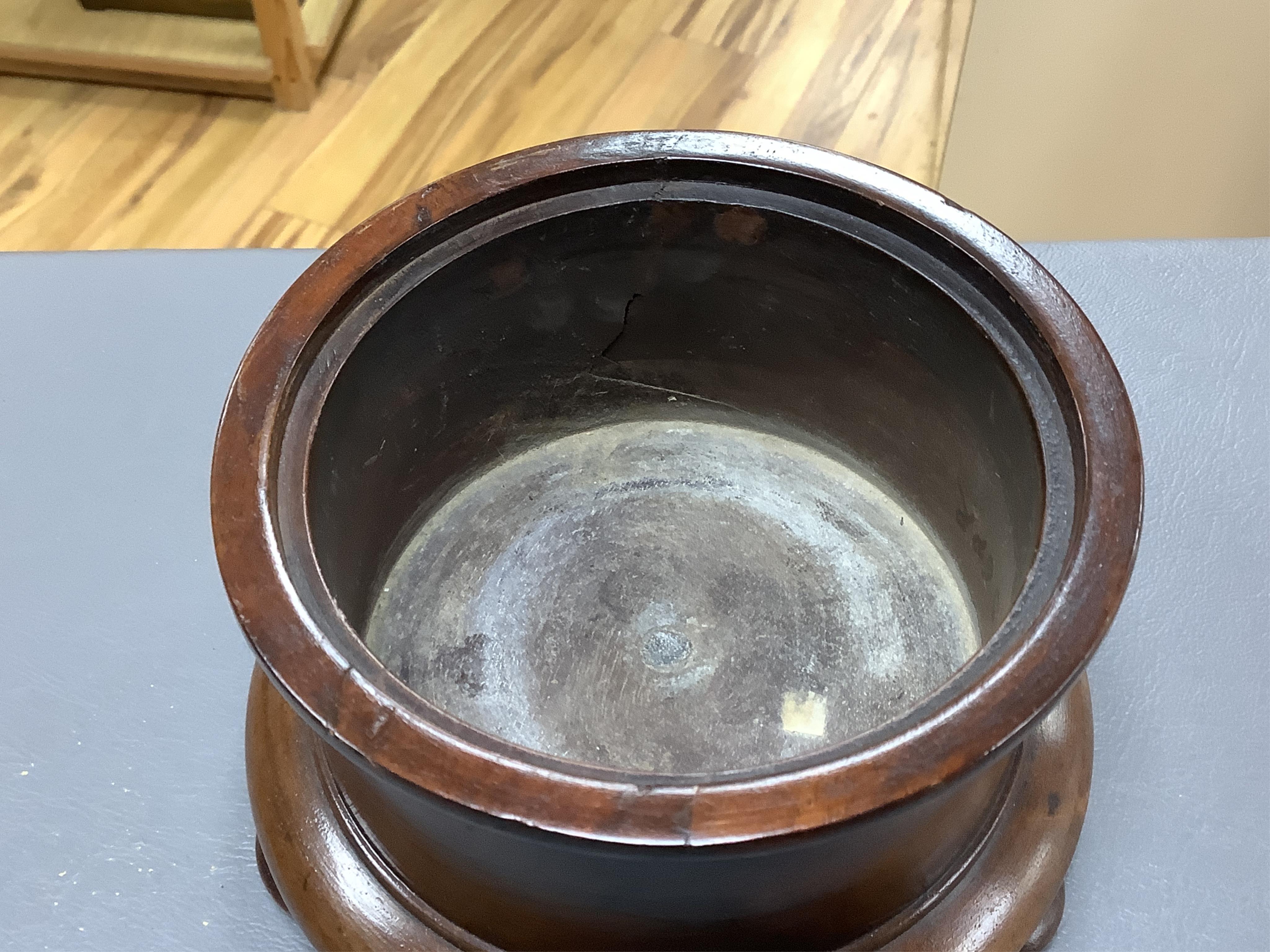 An 18th/19th century lignum vitae wassail bowl and a circular mahogany tobacco box, largest 18cm high